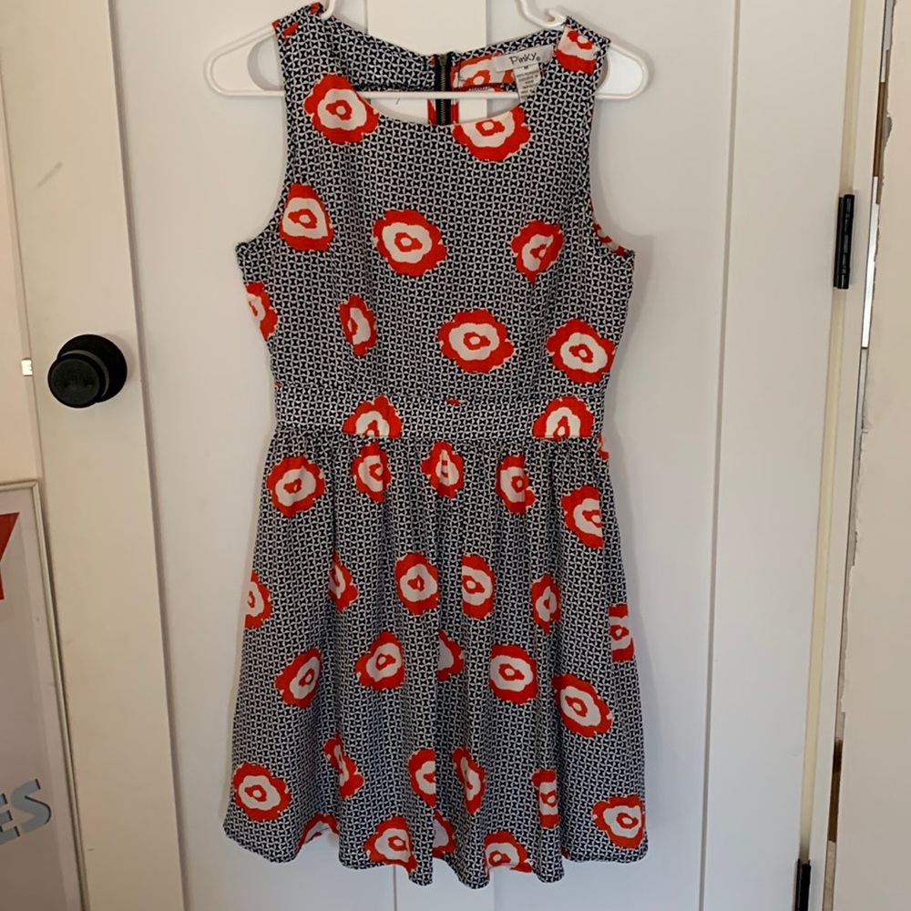 Floral womens dress size M. Super flattering with detailed cutout on back